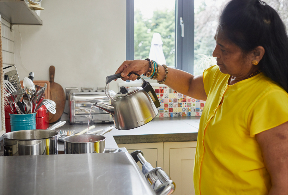 A customer boiling water in their kitchen