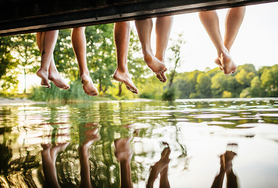 Feet hanging over a jetty