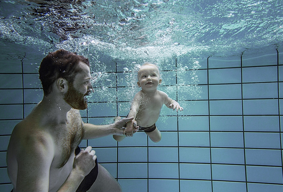 Dad and baby swimming