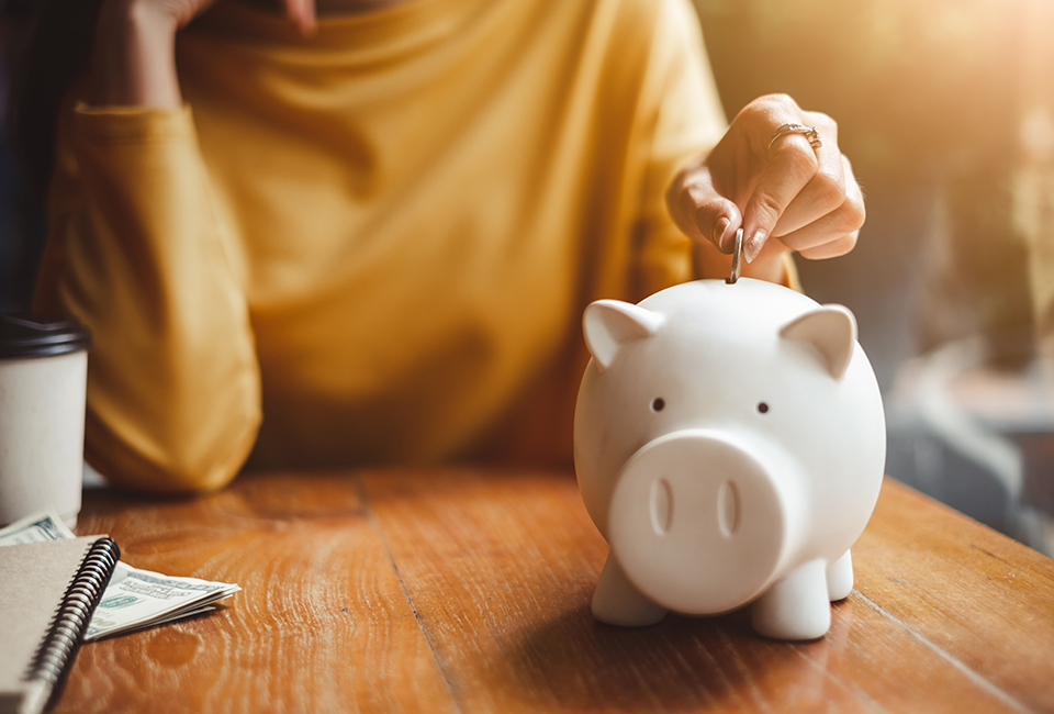 Putting money in a piggy bank