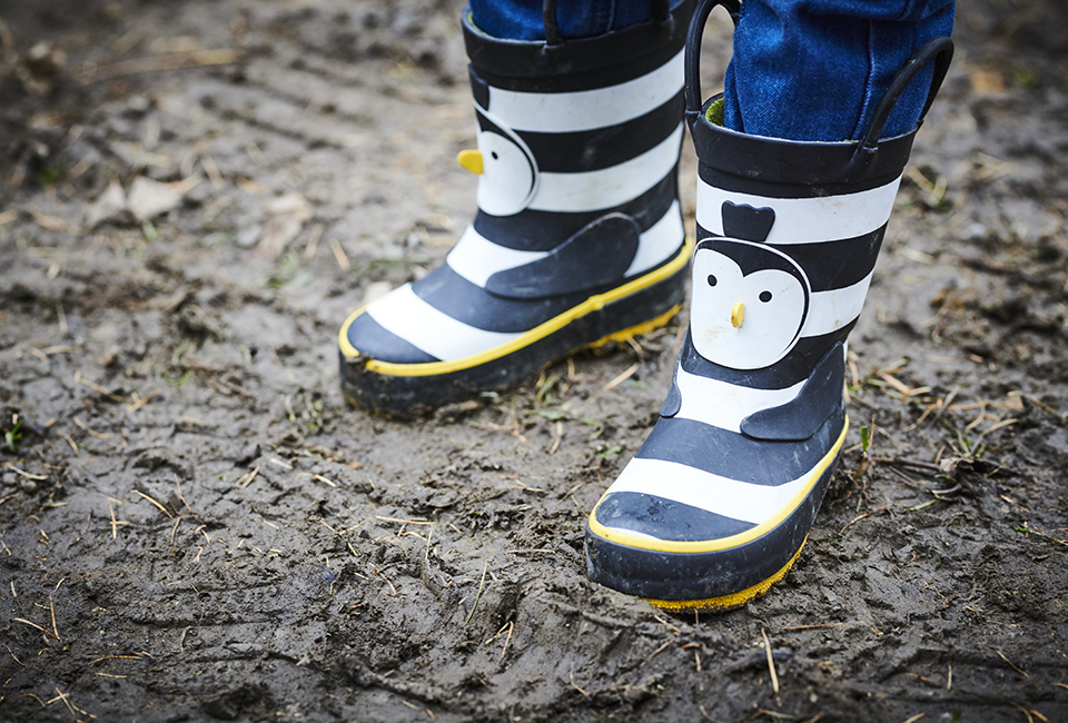 Child wearing wellington boots