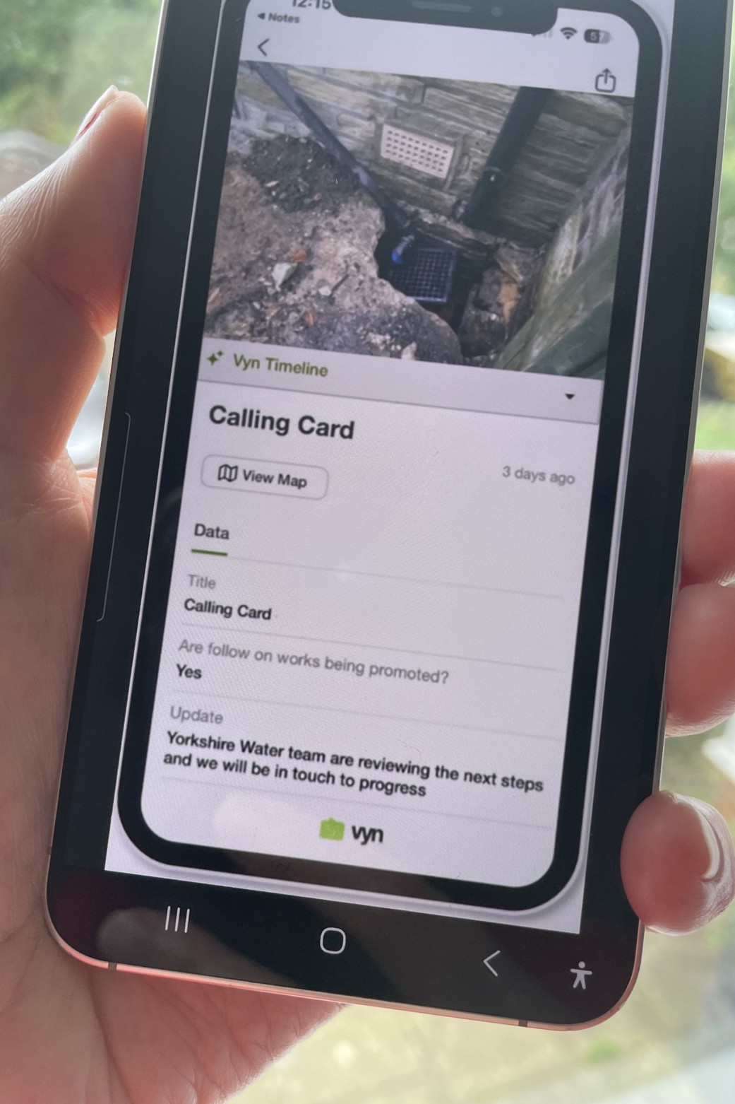 Video message on a mobile phone screen of an exterior drain