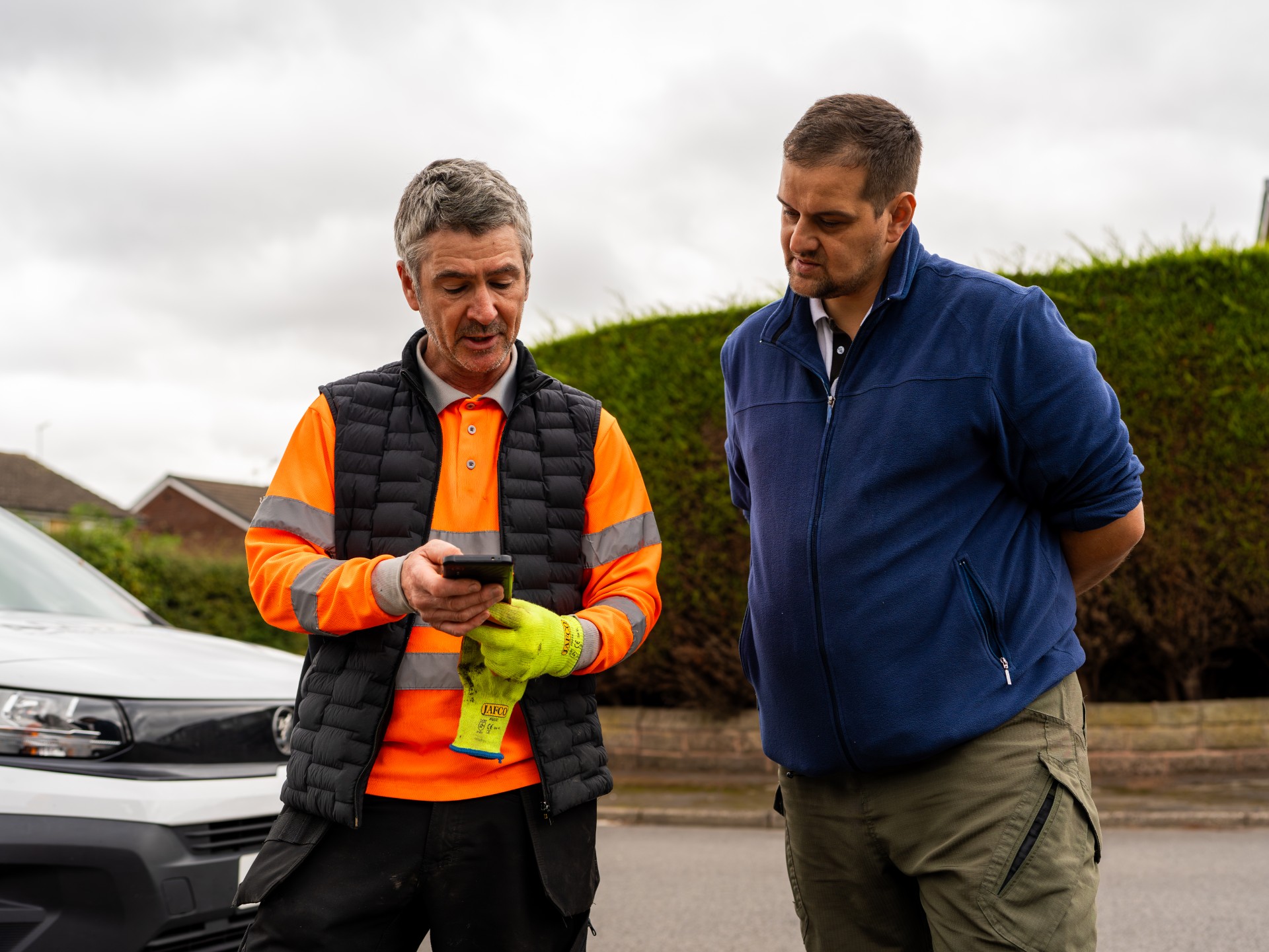Councillor Adam Tinsley with Aquaforce plumber discussing smart meter exchanges in Rotherham