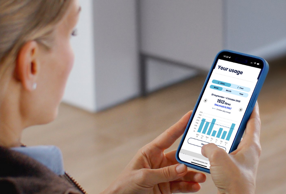 A Yorkshire Water customer using her mobile to view her online account and check her smart meter readings.