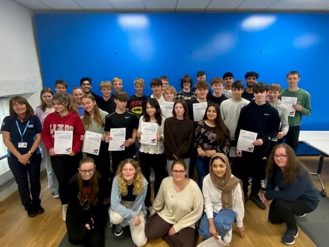 Image of the students holding certificates after completing the 2023 industrial cadet programme
