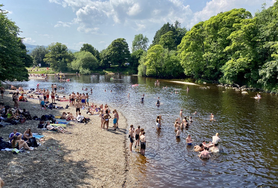 People enjoying the water at Ilkley