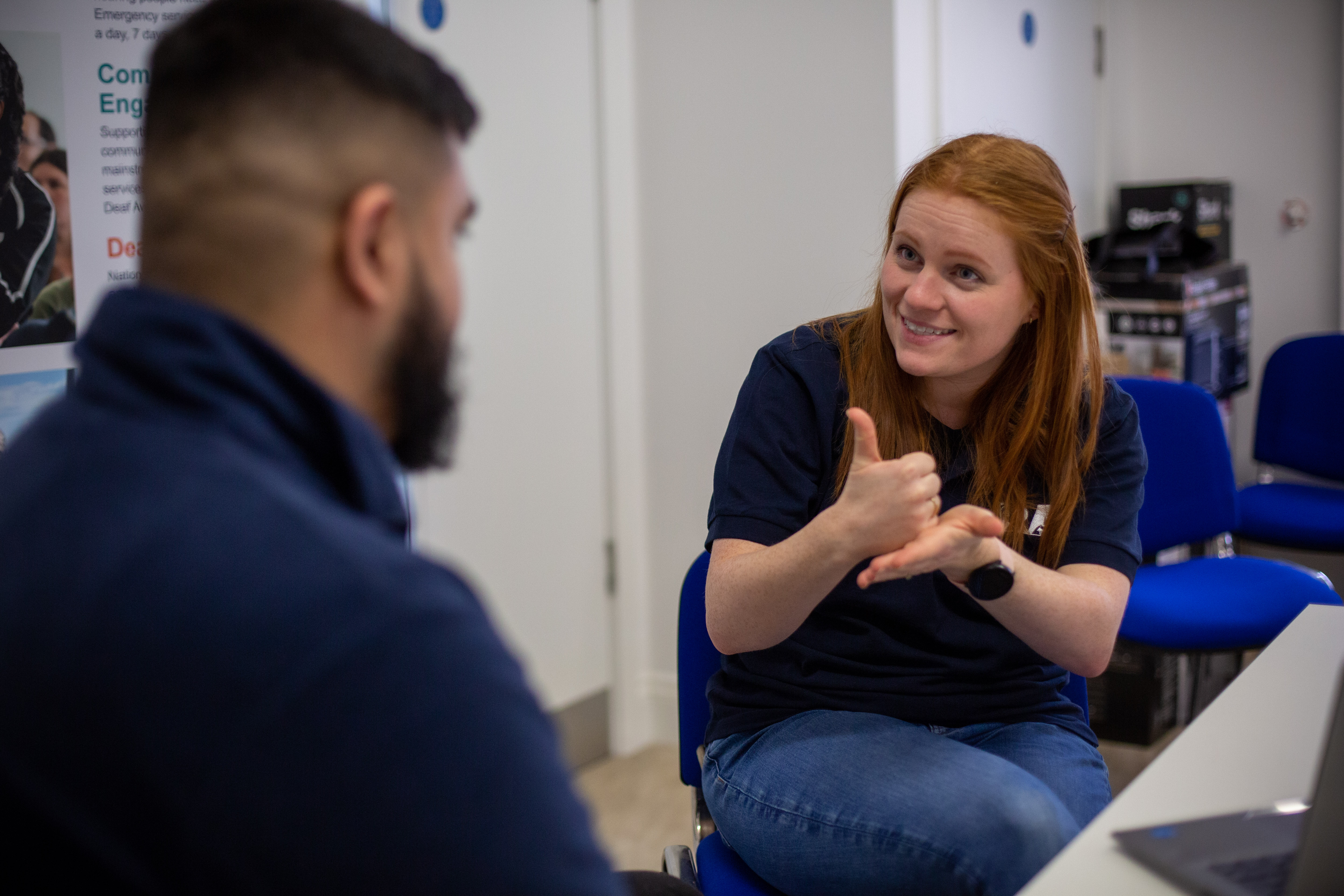 A person using British Sign Language 