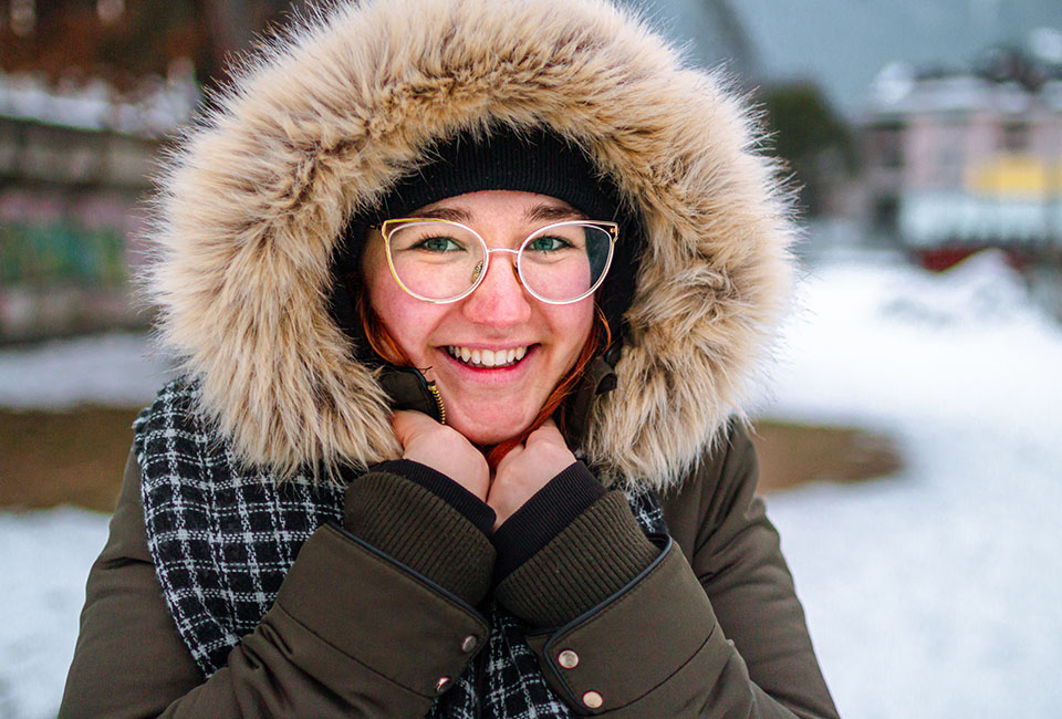 Woman wrapped up in winter coat