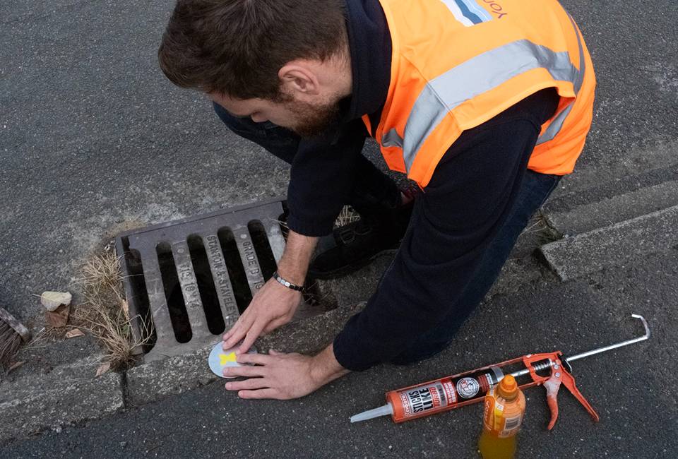 Yellow Fish disc being installed in Bingley