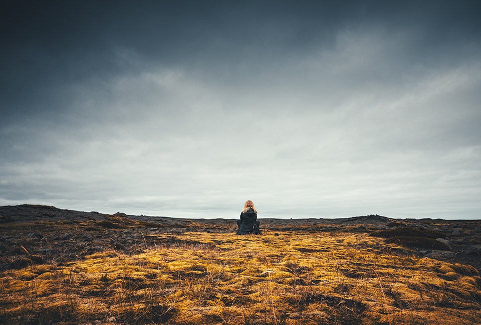 Lady sat on moorland 