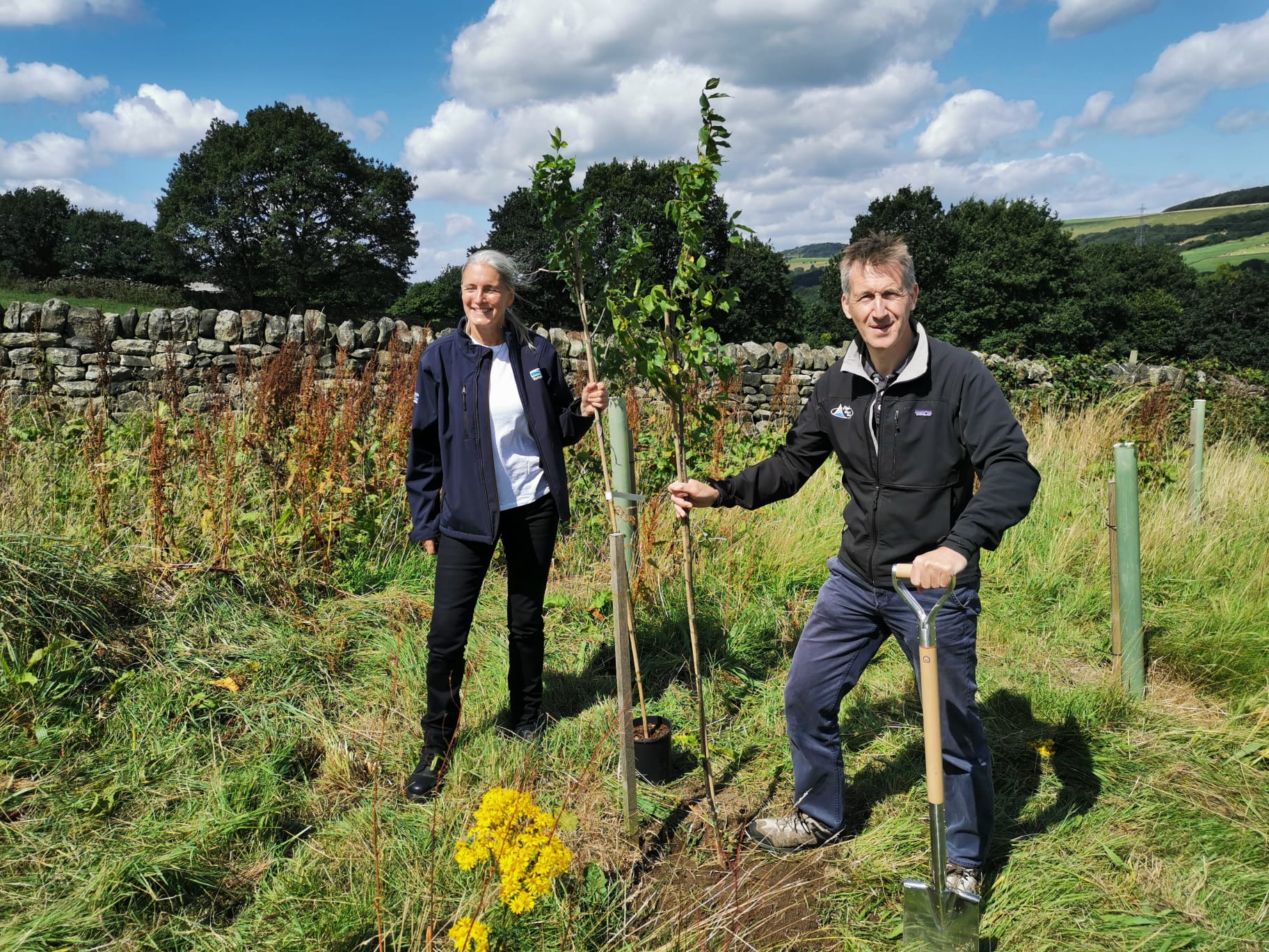 Yorkshire Water CEO Liz Barber and Dan Jarvis planting trees at Underbank reservoir