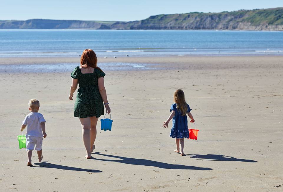 A family playing on the beach in Scarborough