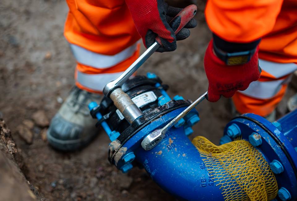 New water main being laid in the ground