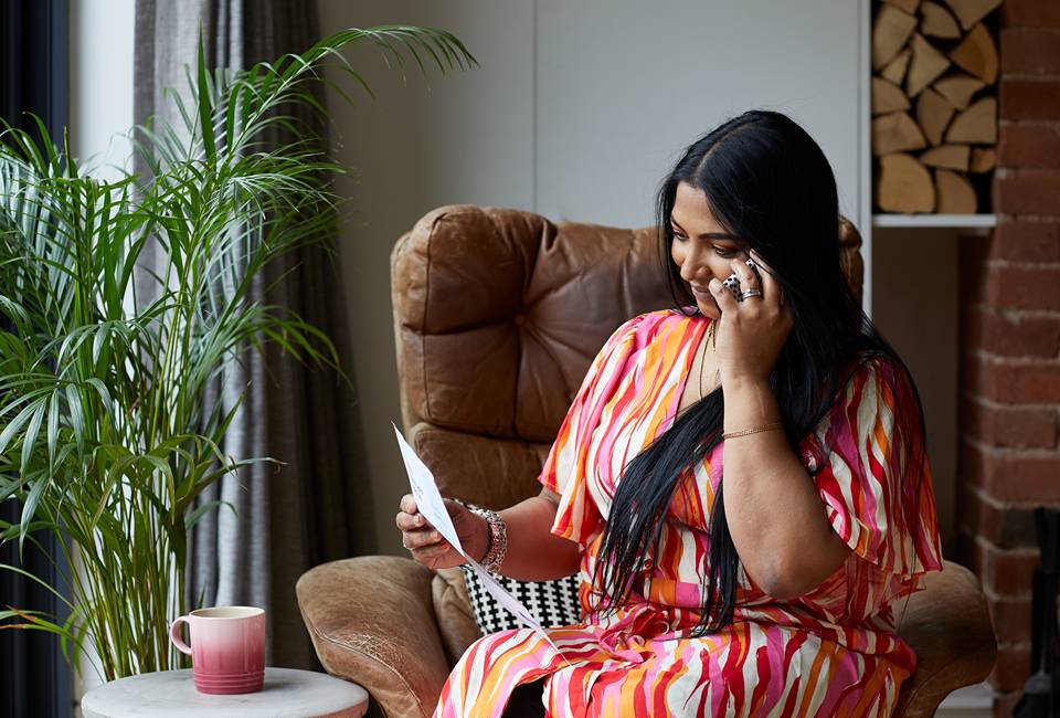 Customer holding bill