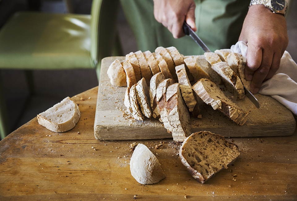 Man slicing bread