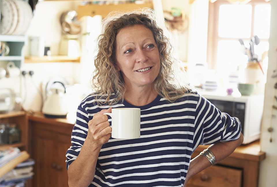 Person drinking from a mug